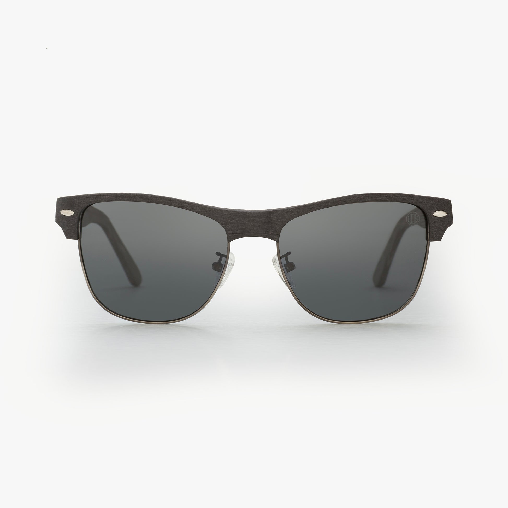 Sunglasses with dark lenses and black frame on a white background
