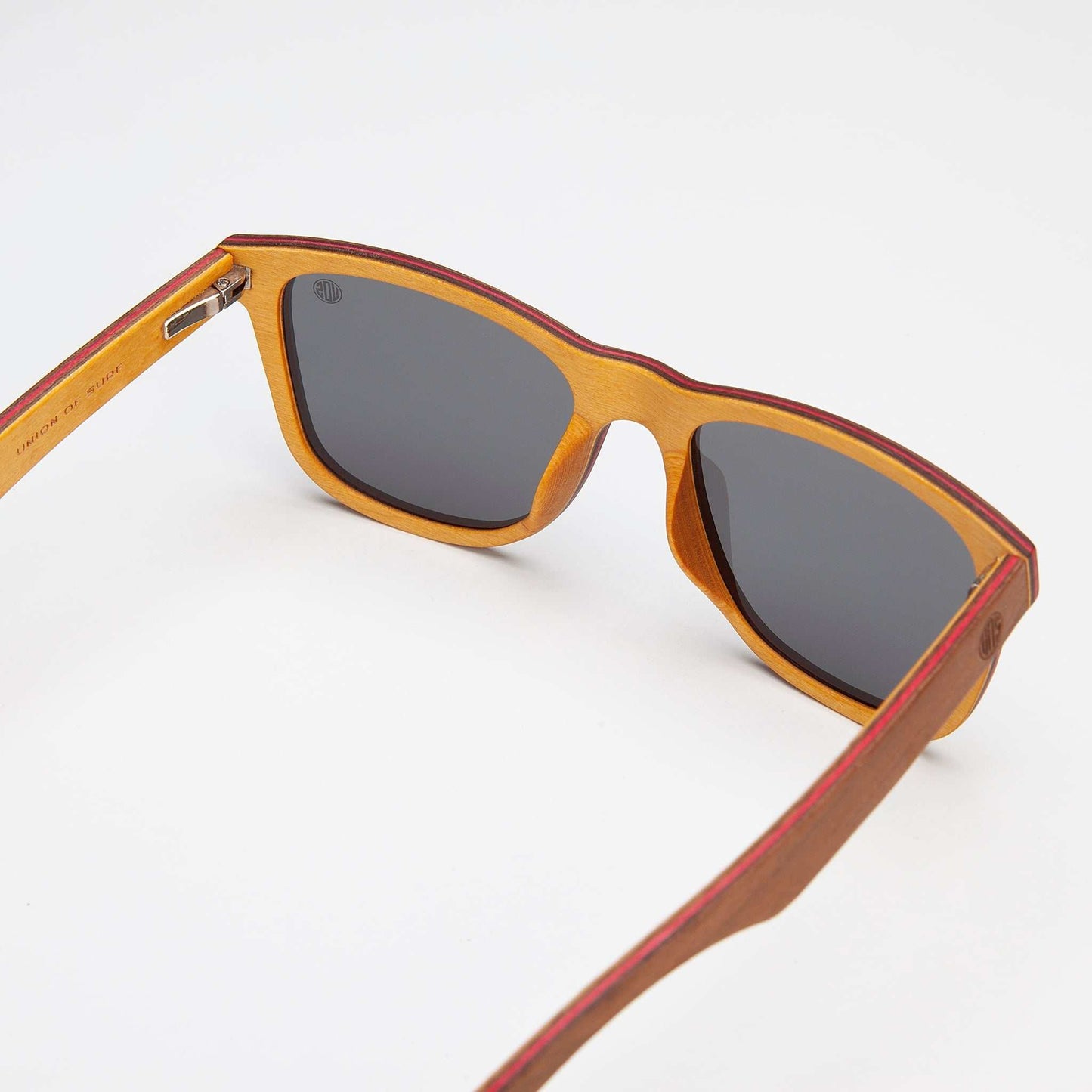 Fistral Sunglasses with polarised black lenses and walnut wood veneer frame for versatile style and UV400 protection