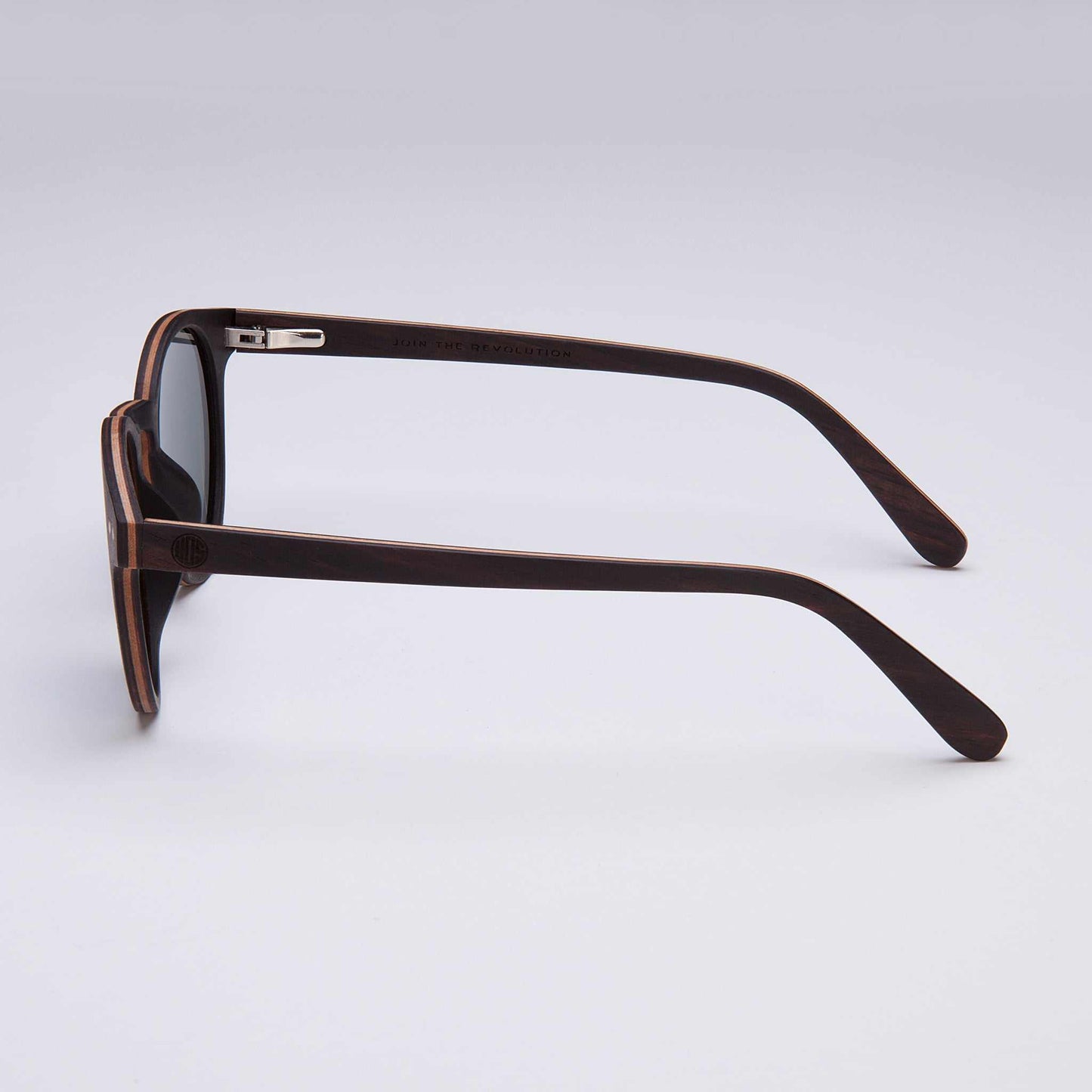 Circular ebony wood sunglasses with black lenses and hand-finished natural wood grain frame.