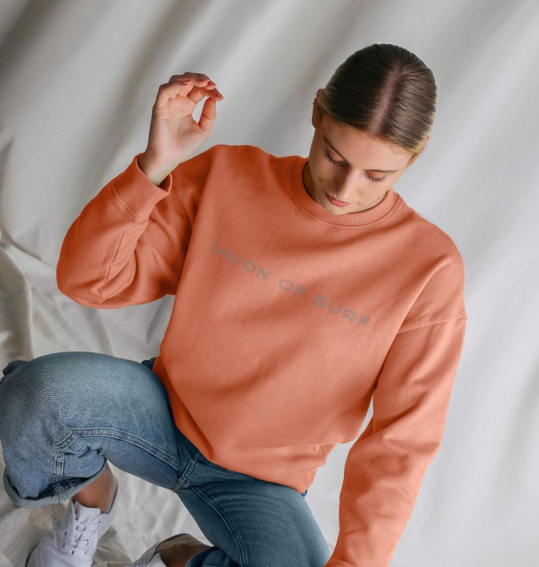model on the beach wears union of surf sweater in organic soft touch cotton