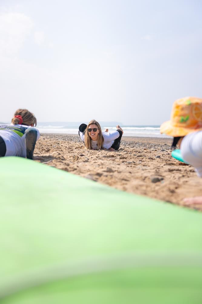 Teaching a surf lesson whilst wearing wooden sunglasses with polarised lenses.