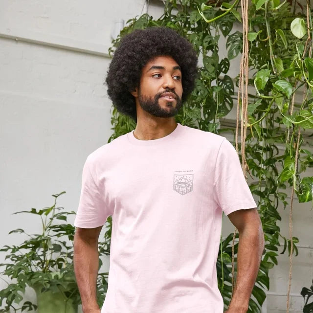 Model wearing Relaxed Fit Organic T-Shirt for Men on a coastal path