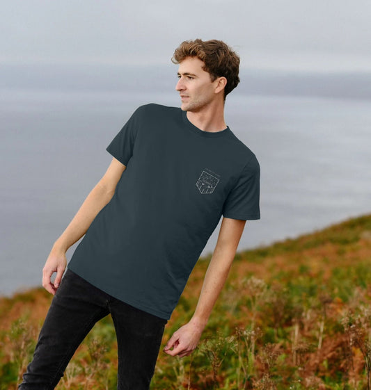 Model wearing Relaxed Fit Organic T-Shirt for Men on a coastal path
