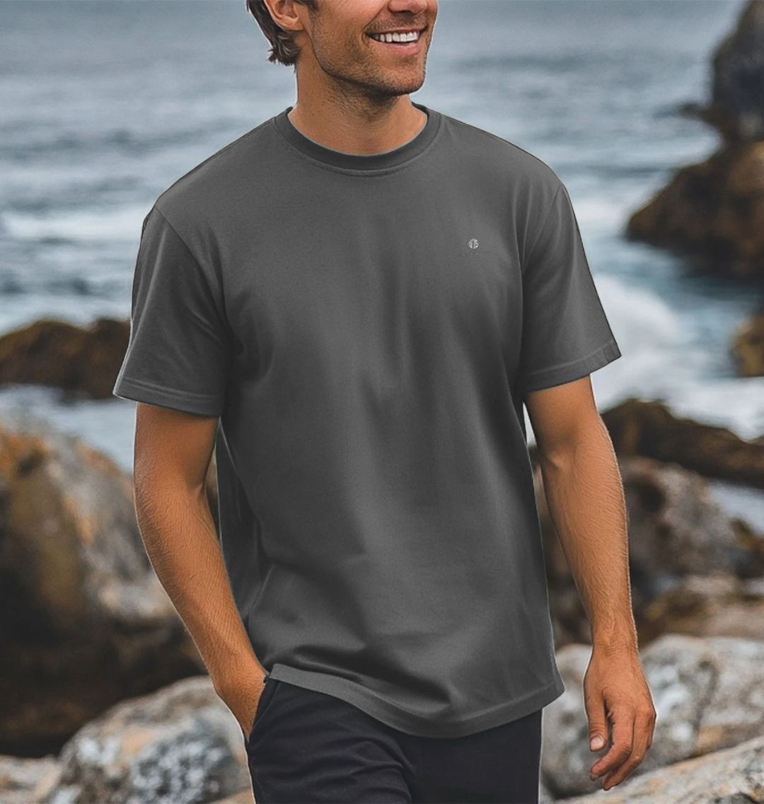 Model wearing Relaxed Fit Organic T-Shirt on a coastal path
