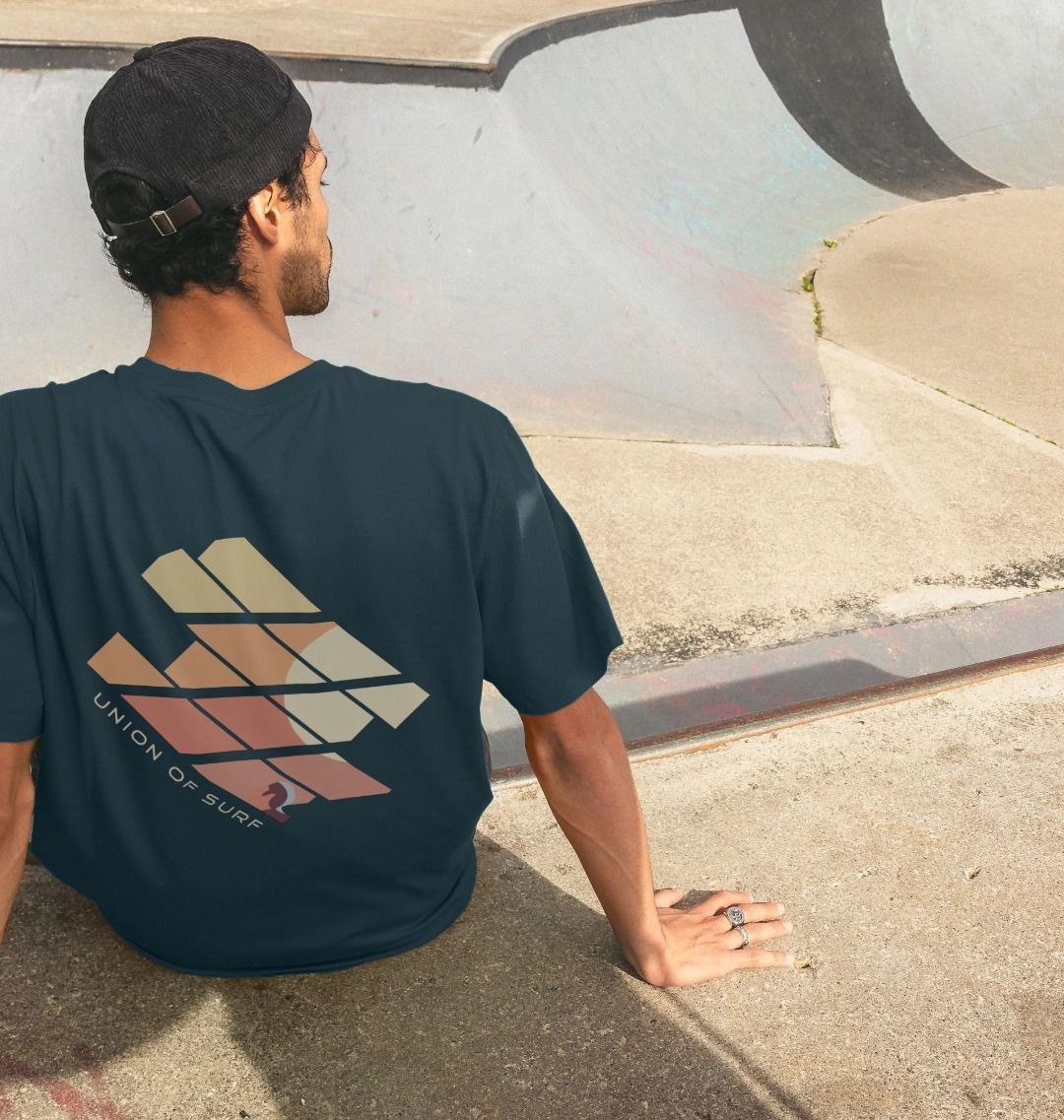 Model wearing Relaxed Fit Organic T-Shirt at a skate park
