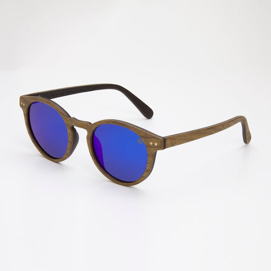 Eco Friendly SunglassesPearl- Blue MirrorCatch the summer rays in style with Pearl sunglasses! Featuring polarized mirrored lenses and stylish walnut wood veneer, they are perfect for long days at the beachPearl- Blue Mirror
