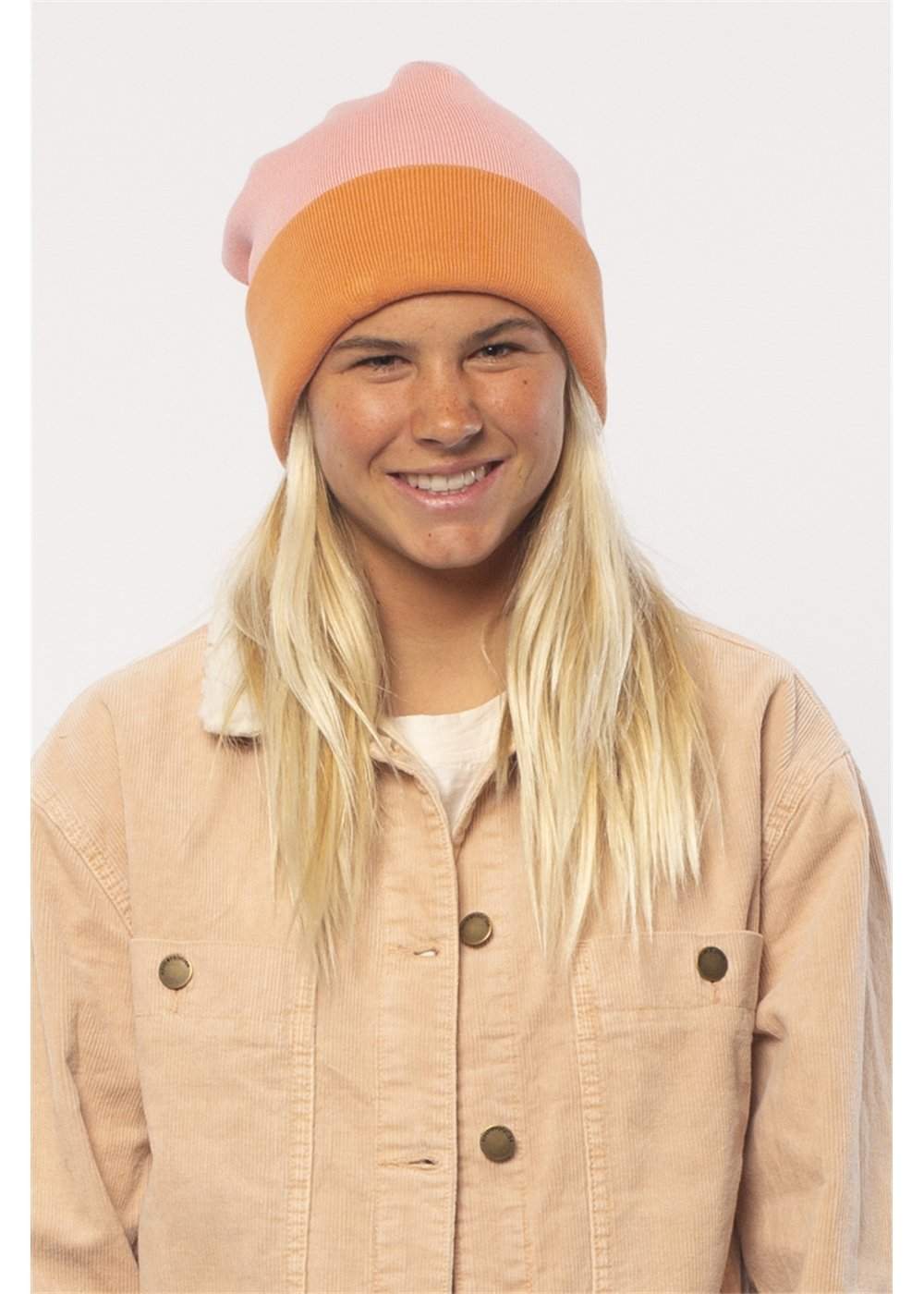 Sisstrevolution August Knit beanie in orange and pale pink, with a two-tone color-block design and folded cuff.