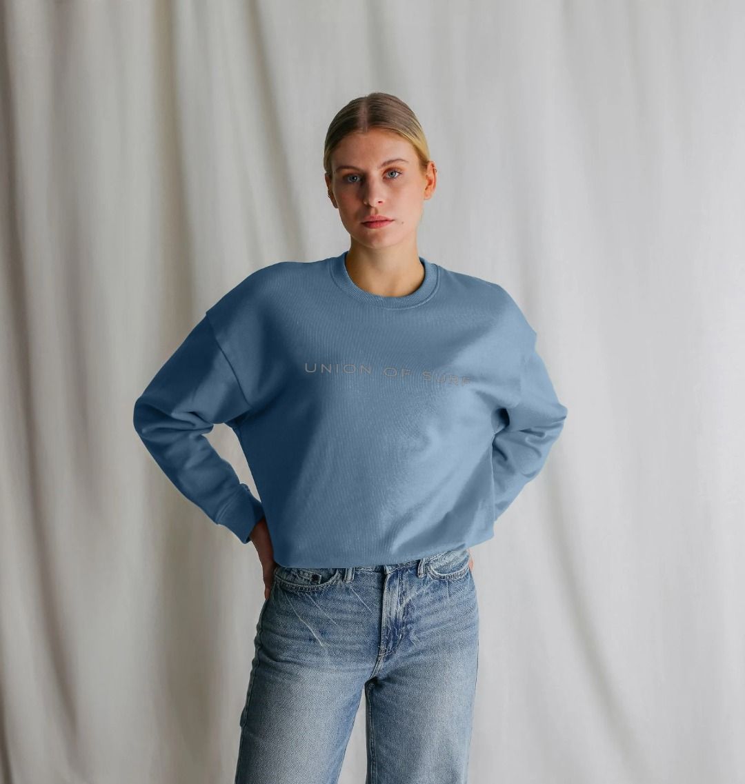 model on the beach wears union of surf sweater in organic soft touch cotton