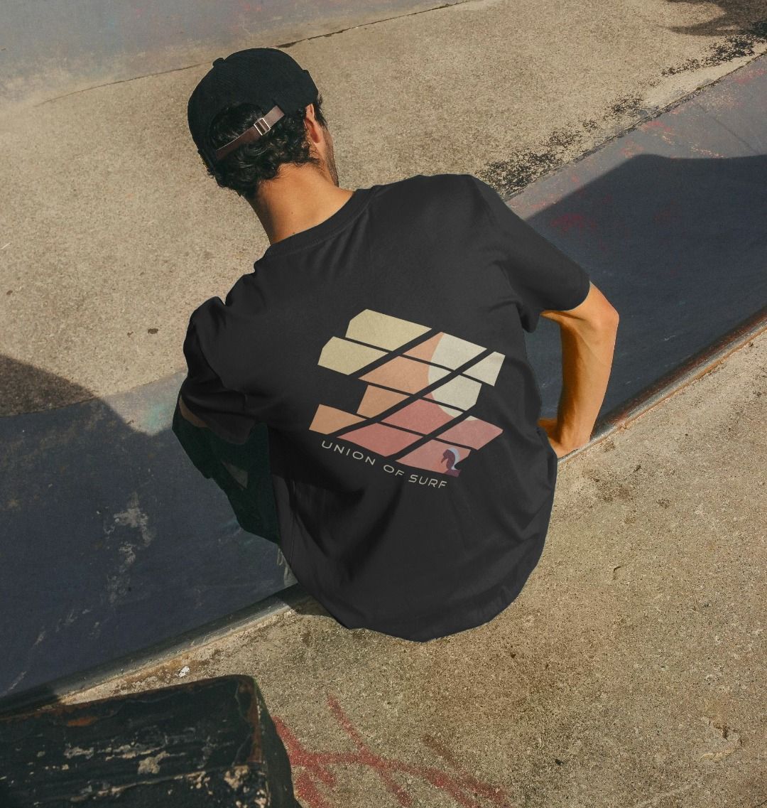 Model wearing Relaxed Fit Organic T-Shirt at the skate park