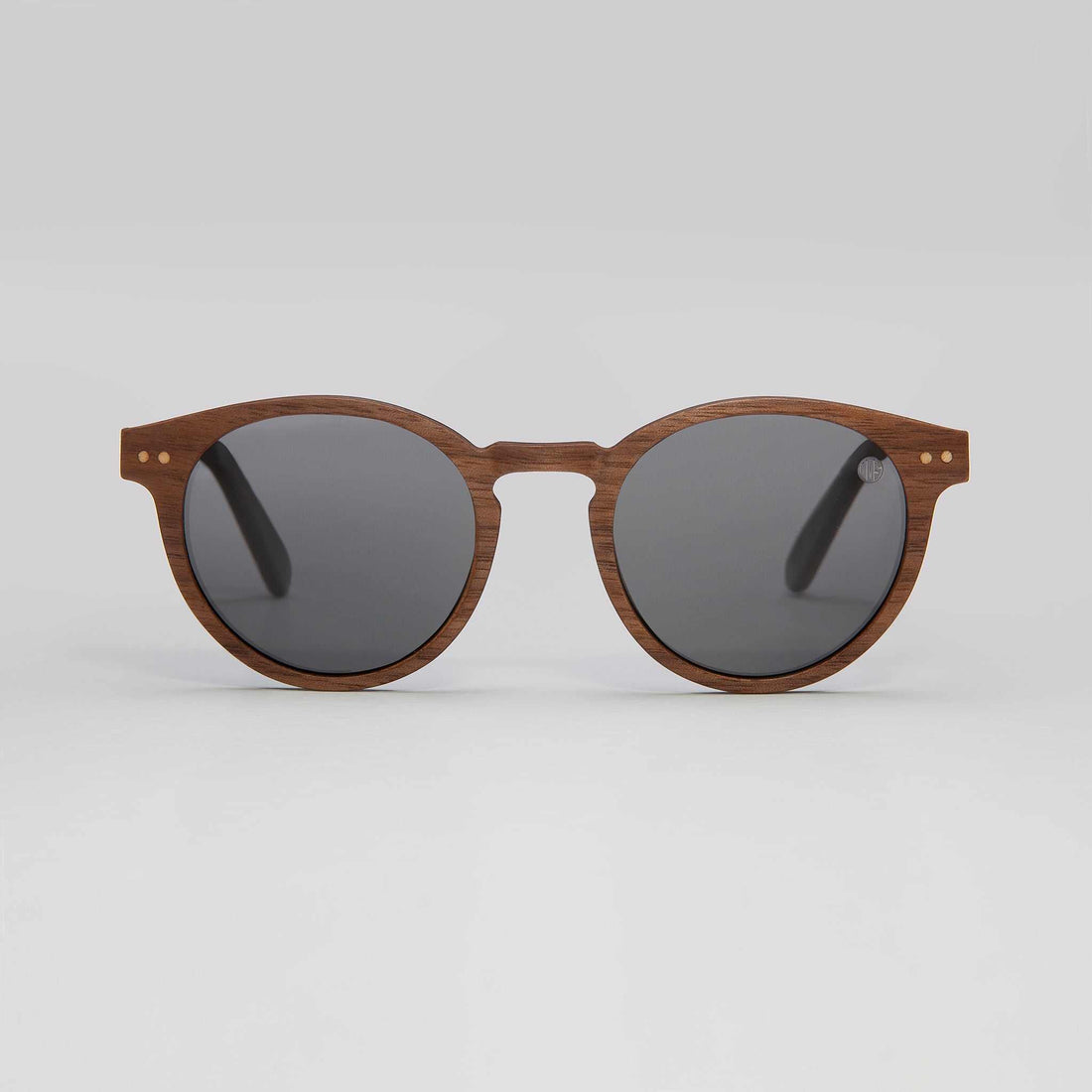 Eye doctor recommending prescribed polarised sunglasses for improved outdoor vision and glare protection