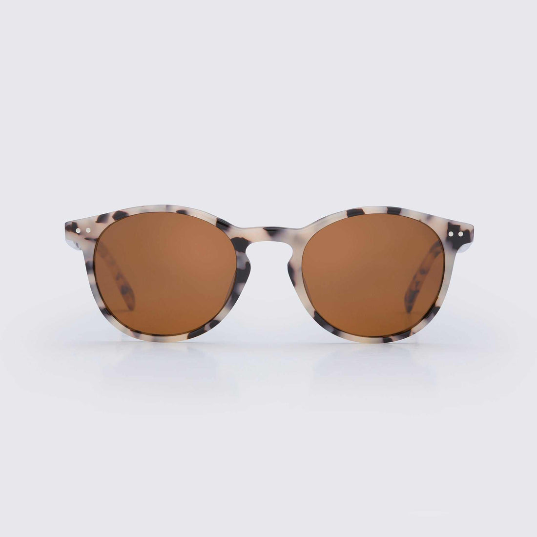 Close-up of stylish bio-acetate sunglasses with polarized lenses designed for sustainable coastal lifestyle