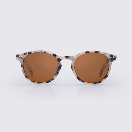 Close-up of stylish bio-acetate sunglasses with polarized lenses designed for sustainable coastal lifestyle