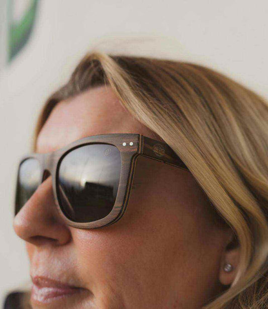 black oversized women's sunglasses with silver mirrored polarized lenses front view