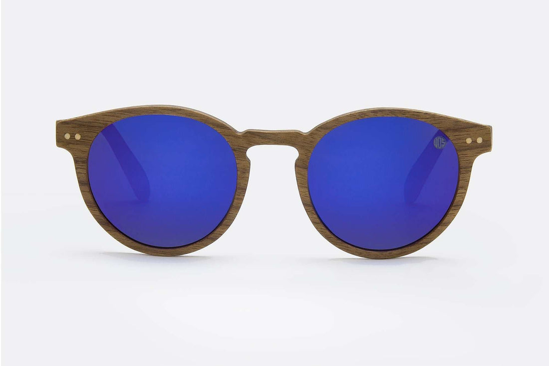 Polarised TAC biodegradable sunglasses lens reflecting lake and snow glare reduction