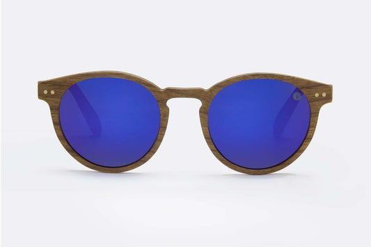 Polarised TAC biodegradable sunglasses lens reflecting lake and snow glare reduction