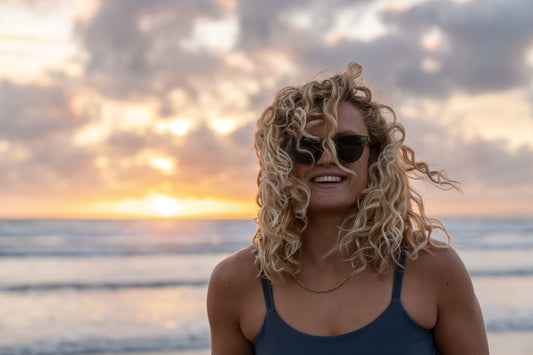 Womens wears polarised sunglasses and the beach