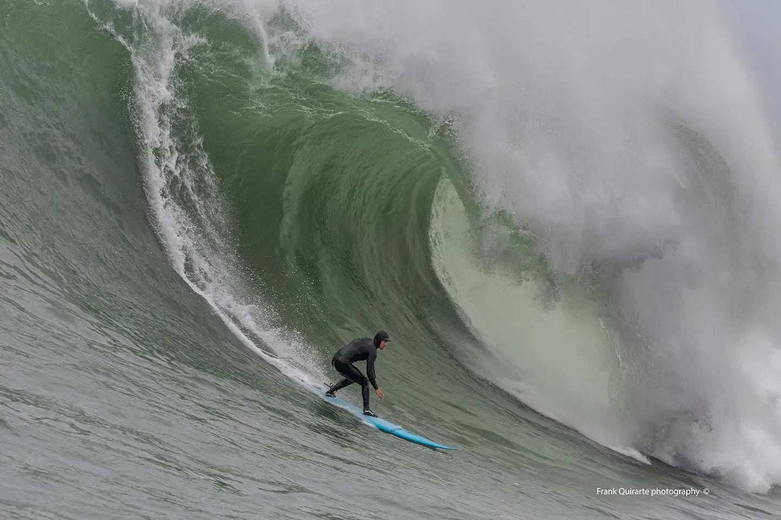 Massive waves crashing at Mavericks big wave surf spot in Northern California during Mavericks season