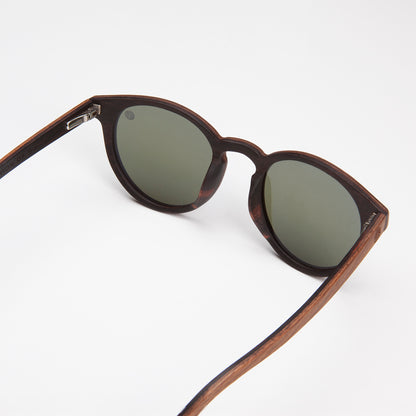 Eco Friendly SunglassesPearl- Blue MirrorCatch the summer rays in style with Pearl sunglasses! Featuring polarized mirrored lenses and stylish walnut wood veneer, they are perfect for long days at the beachPearl- Blue Mirror