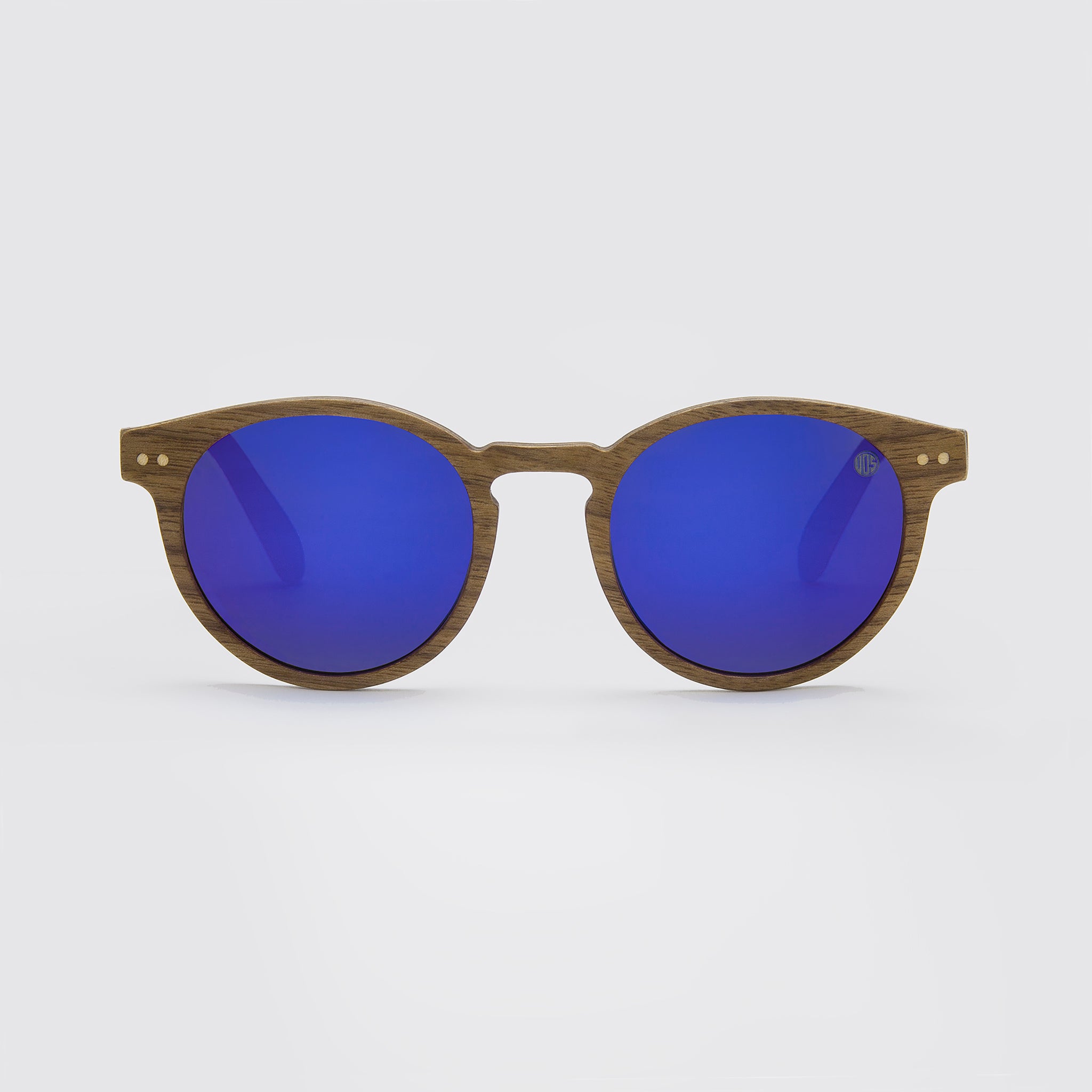 Eco Friendly SunglassesPearl- Blue MirrorCatch the summer rays in style with Pearl sunglasses! Featuring polarized mirrored lenses and stylish walnut wood veneer, they are perfect for long days at the beachPearl- Blue Mirror