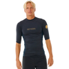 Rip Curl Mens Dawn Patrol short-sleeve rash vest in dark charcoal, with a snug fit, gold chest logo and sleeve emblem.