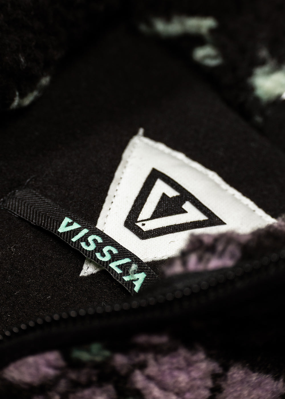 Sherpa fleece pullover with a black woven Vissla patch, mint lettering and triangular logo; Vissla Hiking Ice details.