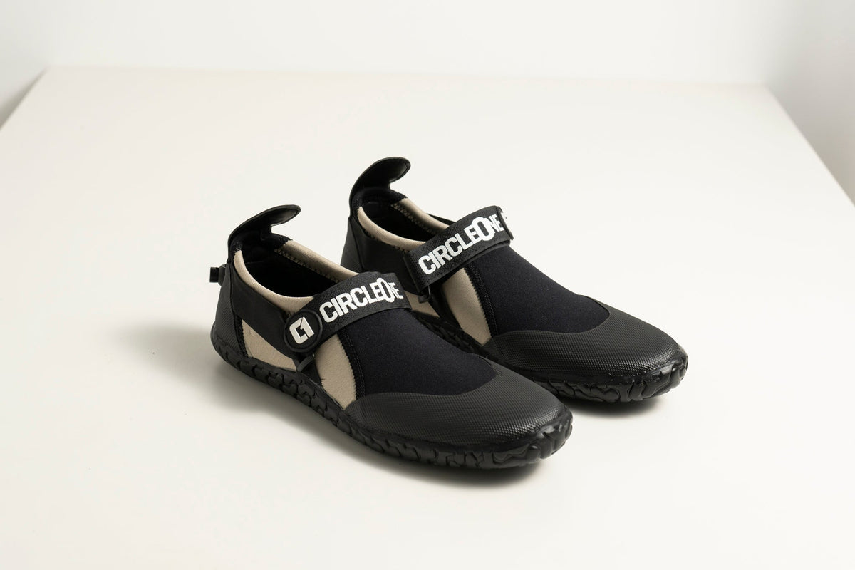 3mm Adult Wetsuit reef boots in black neoprene with textured rubber soles and adjustable branded ankle straps.