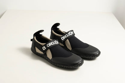 3mm Adult Wetsuit reef boots in black neoprene with textured rubber soles and adjustable branded ankle straps.