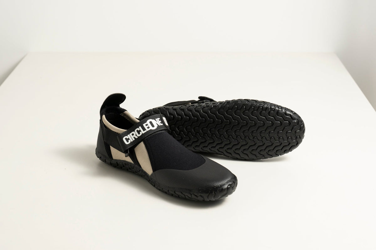 3mm Adult Wetsuit reef boots in black neoprene with a textured rubber sole, ankle strap and drawstring cuff.