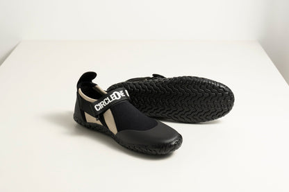 3mm Adult Wetsuit reef boots in black neoprene with a textured rubber sole, ankle strap and drawstring cuff.