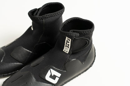 3mm Kids FAZE Wetsuit Boot in black neoprene with a textured rubber sole, ankle-height shaft and adjustable Velcro tab.