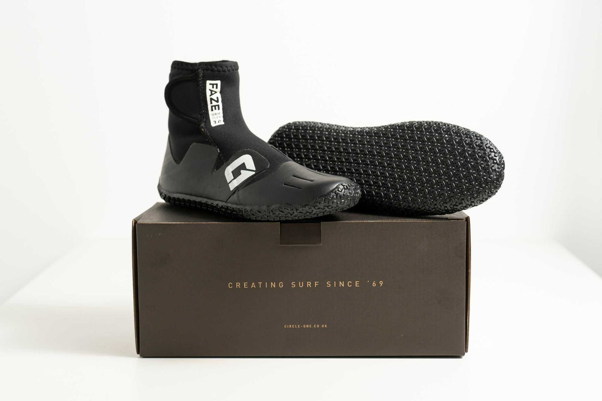 3mm Kids FAZE Wetsuit Boot in black neoprene, with a textured grip sole, ankle support and adjustable entry tab.
