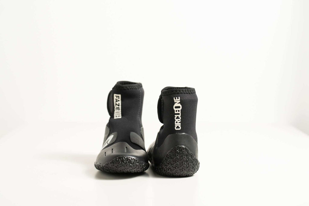 3mm Kids FAZE Wetsuit Boot in black neoprene, with textured rubber soles, ankle cuffs and adjustable closures.