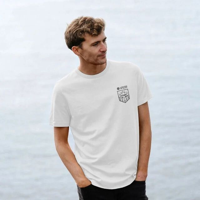 Man wearing organic cotton surf style t shirt at the beach