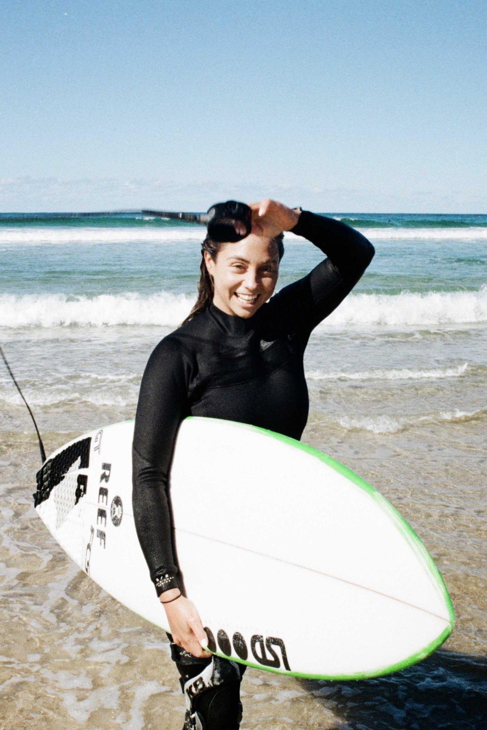 Women wearing Merino Insulator Series 5/4 hooded chest zip wetsuit with thermal merino wool lining