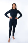 Woman wearing Merino Insulator Series 3/2 chest zip wetsuit with woolly thermal lining for summer surfing