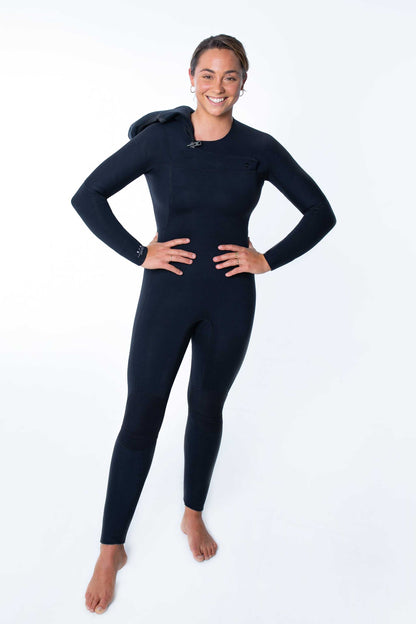 Woman wearing Merino Insulator Series 5/4 hooded chest zip steamer wetsuit with thermal merino wool lining