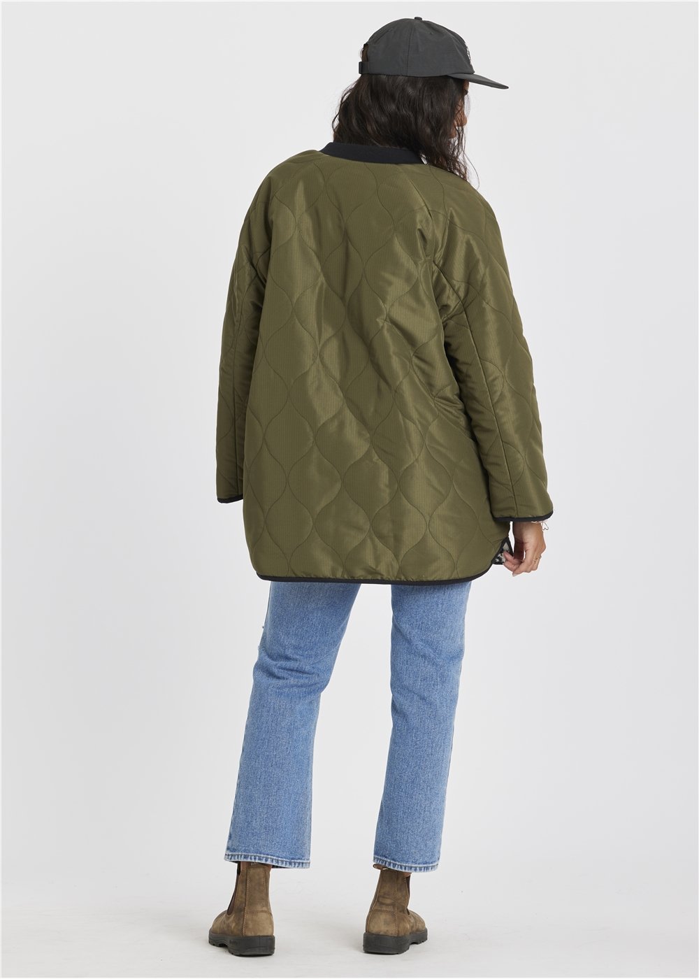 Sisstr Jane Jacket in olive green quilted ripstop nylon, oversized with diamond stitching and a rounded hem.