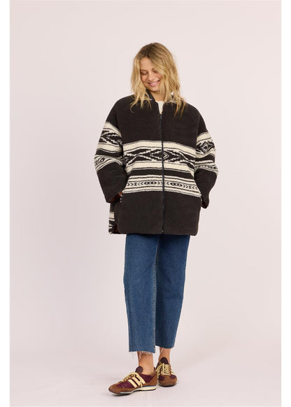 Sisstr Jane Jacket in black and cream patterned sherpa, with a zip front, striped sleeves and oversized fit.
