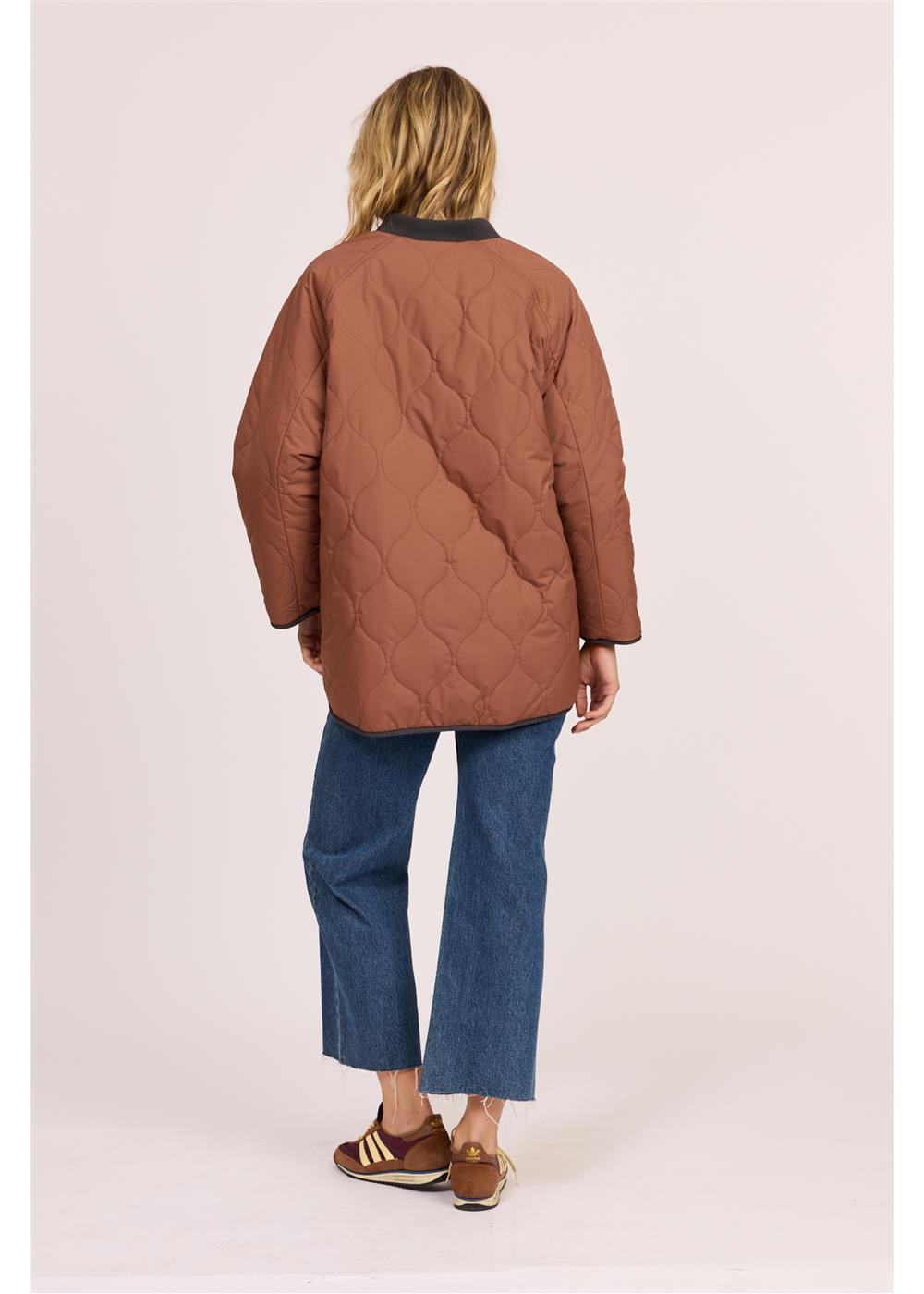 Sisstr Jane Jacket in rust-brown quilted nylon with an oversized fit and diamond stitching across the back