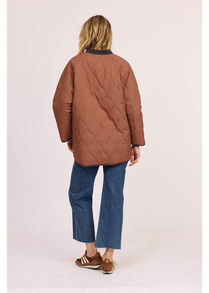 Sisstr Jane Jacket in rust-brown quilted nylon with an oversized fit and diamond stitching across the back