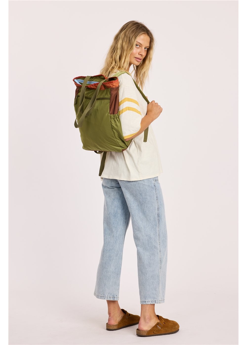 Sisstr Deckhand Tote Backpack in olive green nylon with a rust-red patterned top trim, convertible tote and backpack straps.