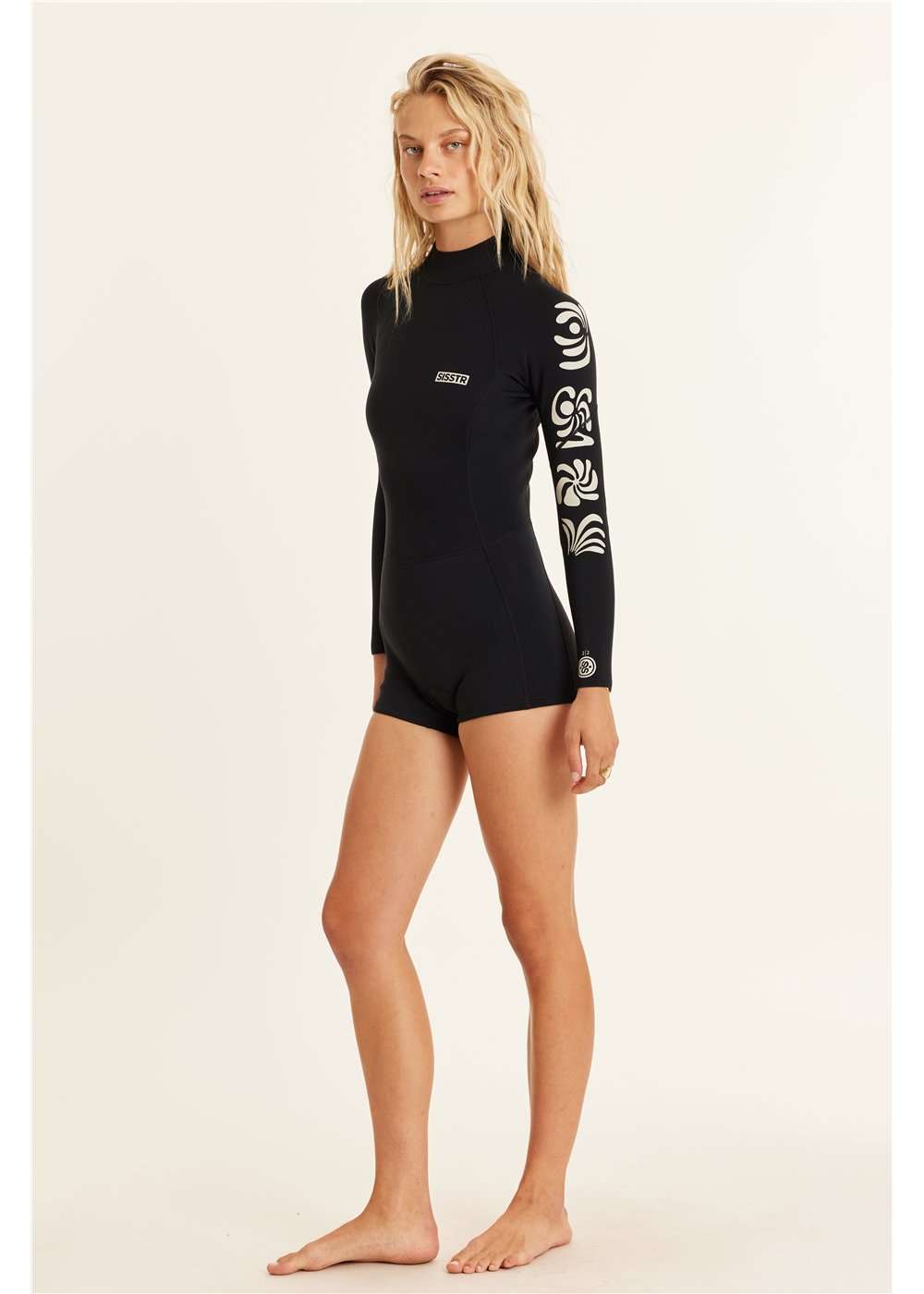 Sisstr 2/2 Summer Seas long sleeve black wetsuit with white tribal patterns on one sleeve and boy short bottom design