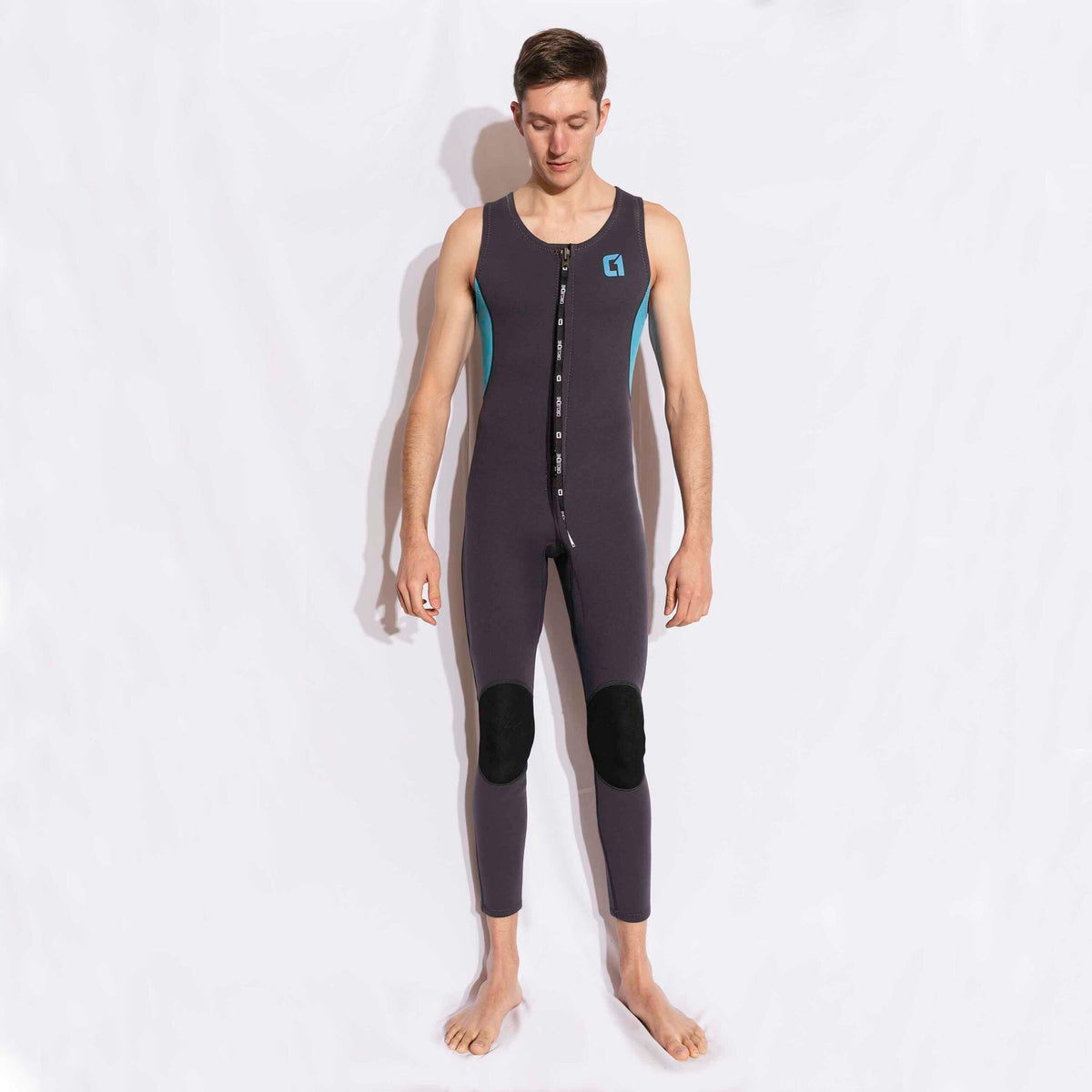 Mens 3/2mm LONG JOHN sleeveless wetsuit in dark grey neoprene with a front zip, teal side panels and black knee pads.