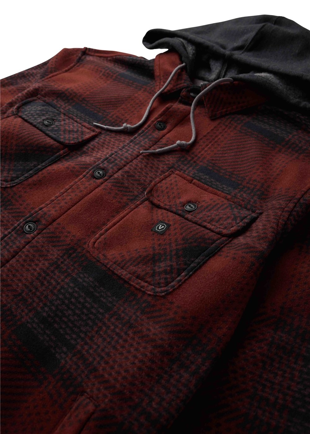 Vissla Eco-Zy Shirt Jacket in red and black plaid fleece, with a black hood, drawstrings, and buttoned chest pockets.