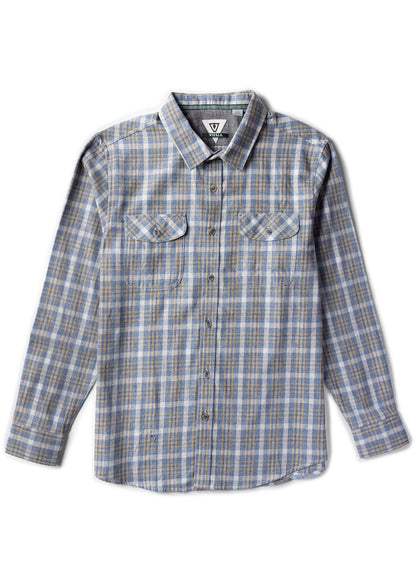 Vissla Central Coast Eco flannel shirt in blue, gray, and tan plaid, with long sleeves and two chest pockets.