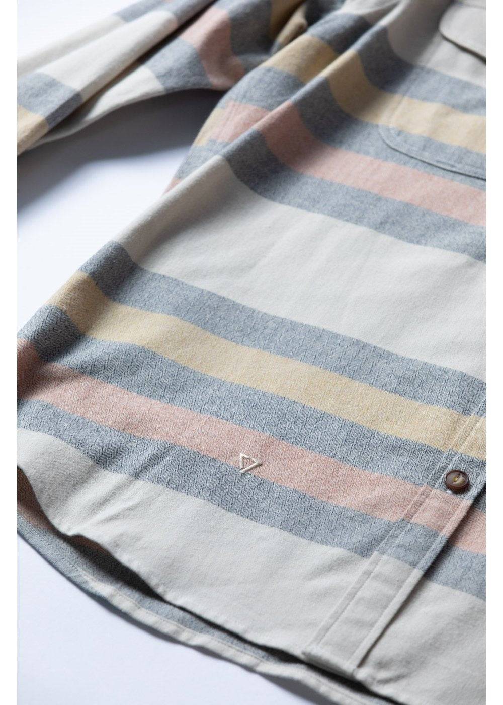 Vissla Central Coast Eco cotton flannel shirt in cream with muted blue, tan and pink plaid stripes, chest pocket and button cuff.