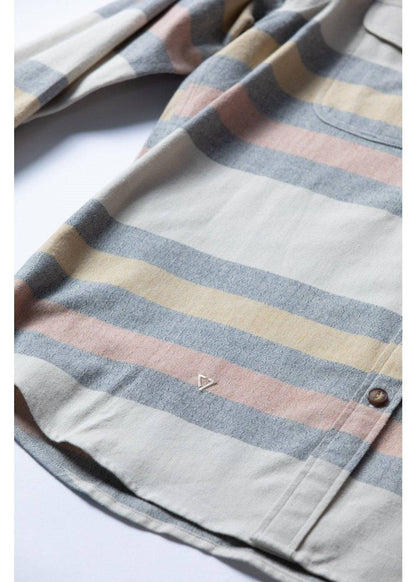 Vissla Central Coast Eco cotton flannel shirt in cream with muted blue, tan and pink plaid stripes, chest pocket and button cuff.
