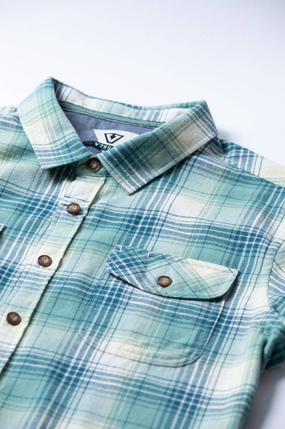 Vissla Central Coast Eco flannel shirt in pale blue and cream cotton plaid, with buttons, collar and chest pocket.