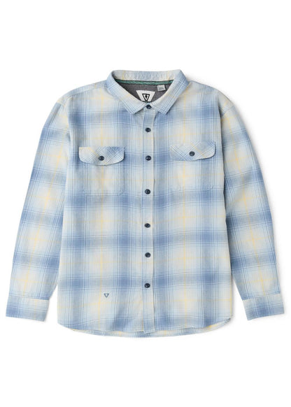 Vissla Central Coast Eco flannel shirt in pale blue and cream organic cotton plaid, with long sleeves and two buttoned chest pockets.