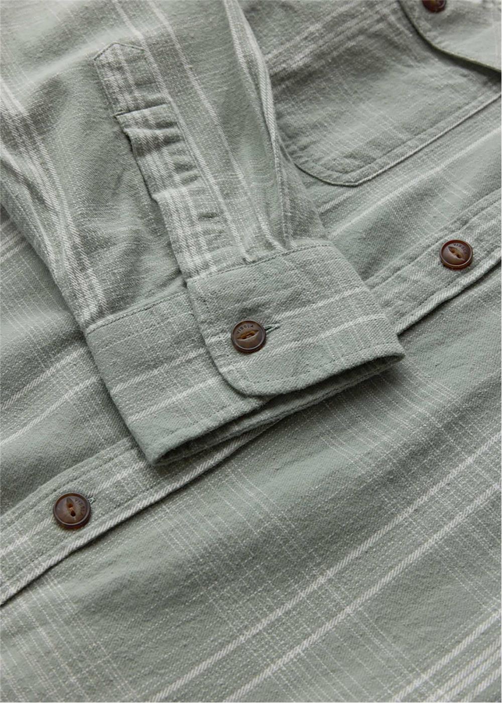 Vissla Central Coast Eco cotton flannel shirt in muted sage green plaid, with a button cuff and chest pocket.